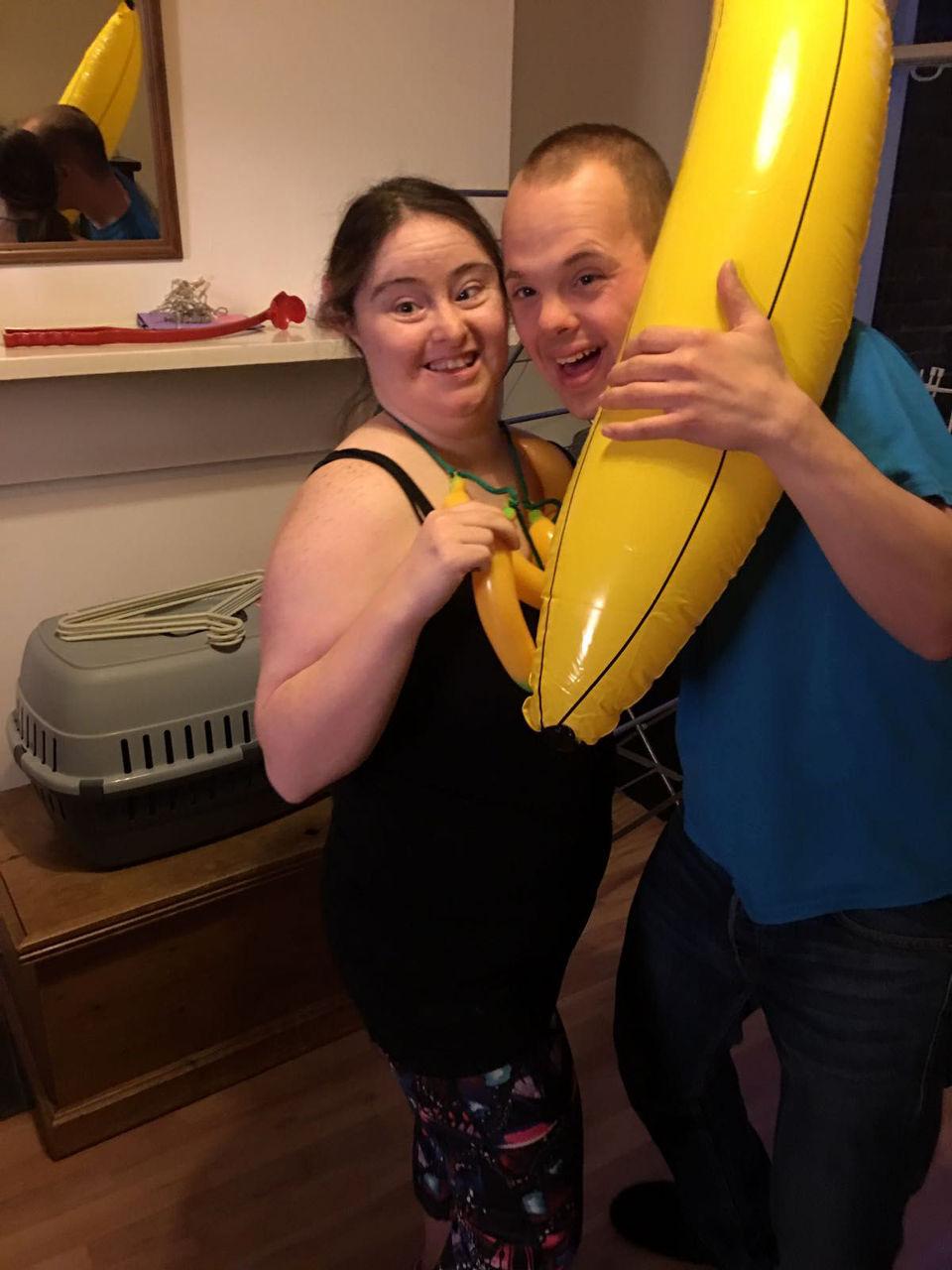 Sam and Hilly holding a blow-up banana.