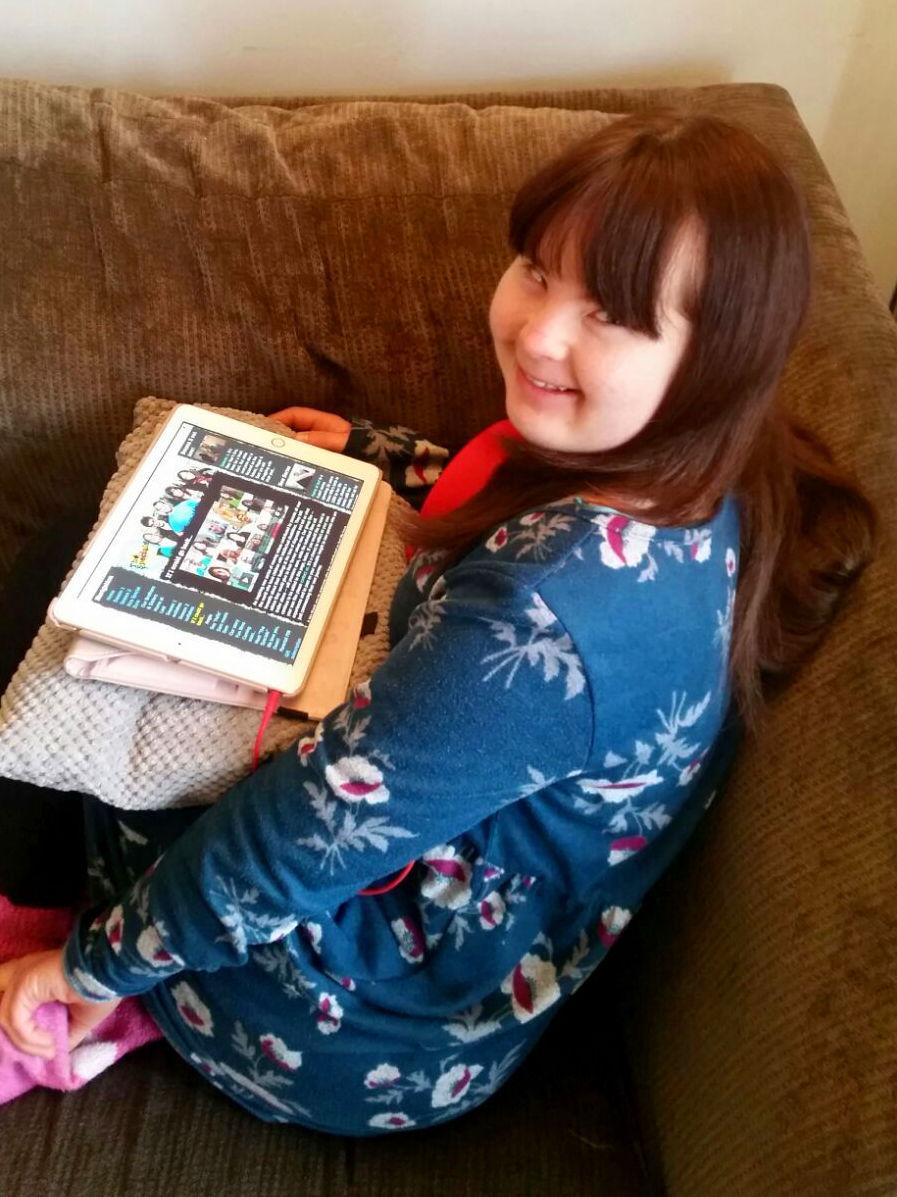 Megan looking at our new website on her tablet.