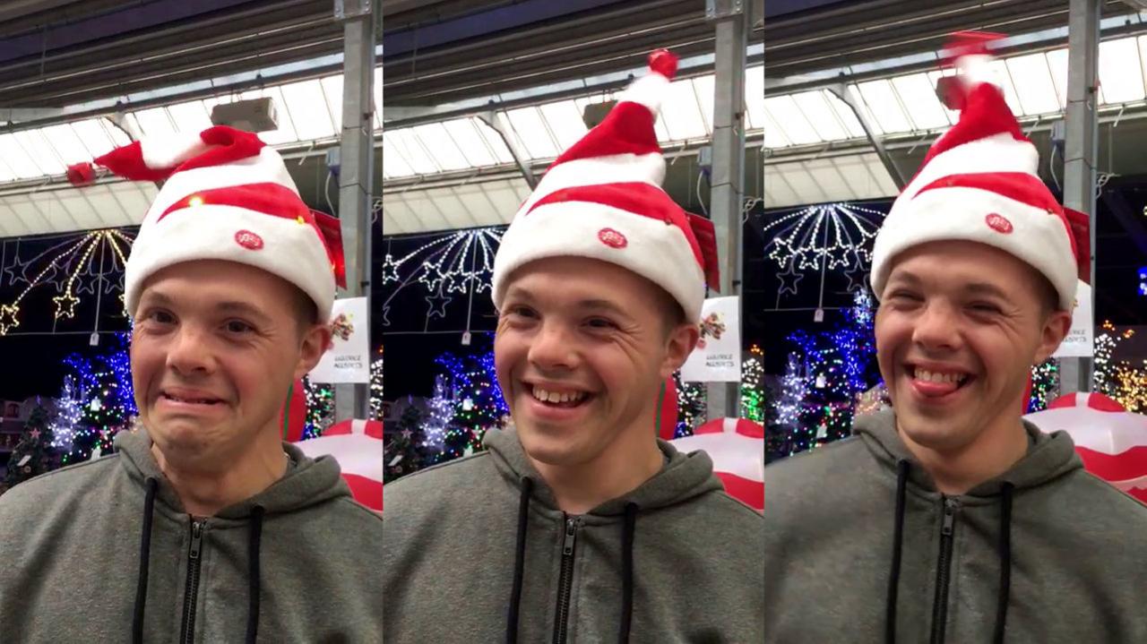 Sam wearing a dancing Christmas hat.