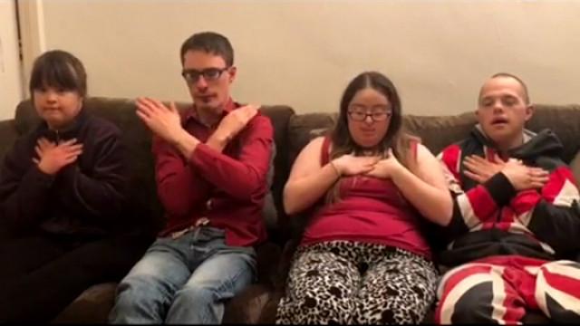 Megan, Lewis, Hilly and Sam doing Makaton on the sofa.